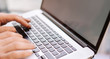 © Rymden - Close-up photo of male hands with laptop. Man is working remotely at home. Freelancer at work