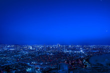 High Angle View Of Illuminated Cityscape Against Clear Blue Sky