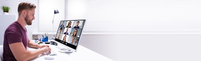 Wall Mural - Businessman Watching Video Conference