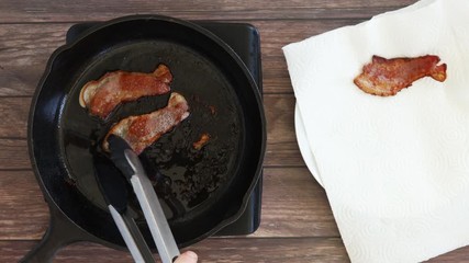 Wall Mural - Draining Bacon on a Paper Towel After Cooking