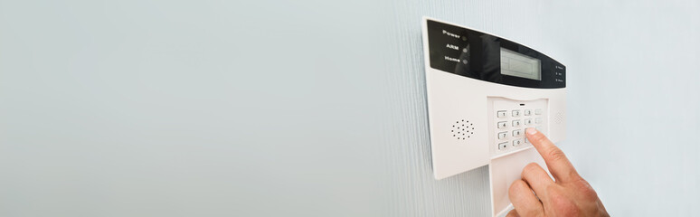 person's hand entering code
