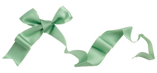 Wall Mural - Green ribbon curl isolated on white background. Bright green ribbon bow and curl isolated on white background. Textile accessories for sewing and gift scrapbooking decorations. Atlas or silk ribbon