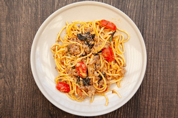 Wall Mural - Spaghetti bolognese with tomato, cheese and basil on a plate