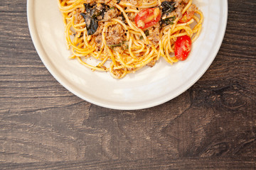 Wall Mural - Spaghetti bolognese with tomato, cheese and basil on a plate