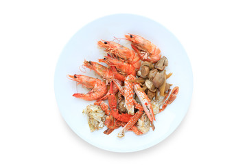 Wall Mural - Baked Prawns and Crab on white circle ceramic plate isolated over background.