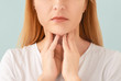 © Pixel-Shot - Woman with thyroid gland problem on light background