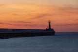 Fototapeta  - sunset in the baltic sea overlooking the pier