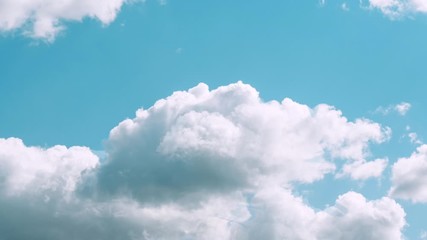 Wall Mural - Motions clouds. Puffy fluffy beautiful white clouds sky time lapse. Slow moving clouds.