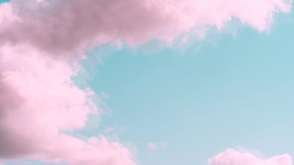 Wall Mural - Motions clouds. Puffy fluffy beautiful pink clouds on turquise sky time lapse. Slow moving clouds. Pastel palette. Fantasy paradise concept