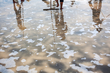 salt farmer on salt field Long Dien, Ba Ria Vung Tau, Vietnam.