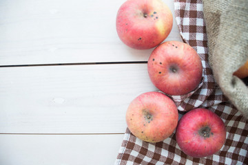 ripe apples on a wooden background