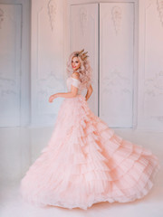 Wall Mural - Cheerful beautiful princess girl blonde laugh smiling. Luxury ballroom evening elegant trendy tulle pink dress fluttering fly motion. Happy cute face Queen. woman enjoy holiday. Backdrop white room.