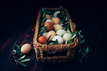 High Angle View Of Eggs And Herbs In Basket