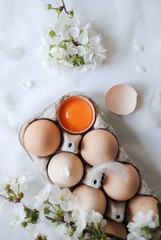 Wall Mural - Chicken eggs in a tray, broken egg.