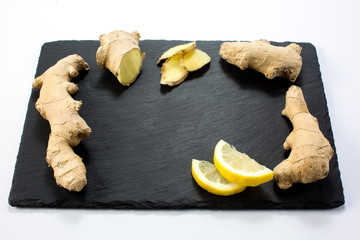 Ginger lemon on black stone.