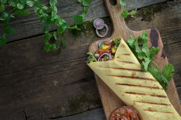 Sticker - burritos on a wooden background