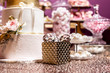 Golden gift on a Birthday sweet and cake table service
