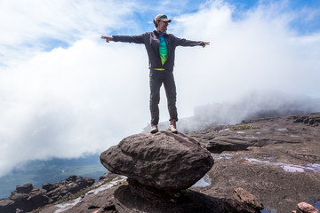 Wall Mural - Man with open arms. Mount Roraima, Venezuela.