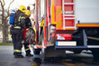 © luckybusiness - Fireman  pack equipment on the fire truck.firefighter  successfully completed the firefighting