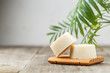 Eco friendly solid shampoo soap bar on wooden dish