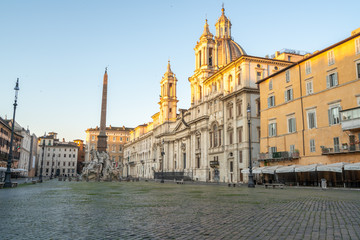 Piazza Navona in Rome appears like a ghost city during the covid emergency  lock down, grass on the floor