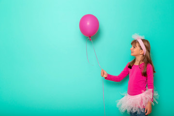 Wall Mural - Birthday girl holding a balloon