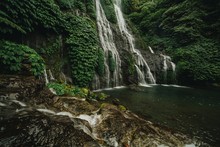 Scenic View Of Waterfall In Forest