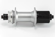 © Pokoman - Bicycle repair. Mountain bike workshop. Rear hub under the disc brake on a white background. The body is silver. Spare parts for a bicycle of a famous manufacturer and brand.
