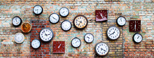 Collection Of Old, Vintage, Hinged Watches, All Clock Show Different Times, Some Do Not Have Insoles, They All Hang On An Old Brick Wall, Bricks Changed Color From Time To Time