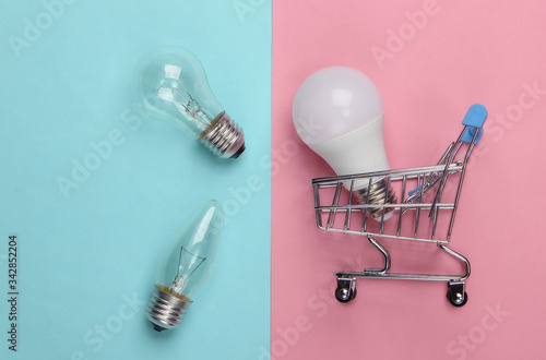 Energy Saving Concept Supermarket Shopping Trolley And Light Bulbs On Pink Blue Pastel Background Top View Buy This Stock Photo And Explore Similar Images At Adobe Stock Adobe Stock