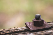 Close-up Of Nut And Bolt On Wood