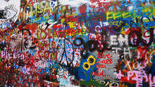 Bright Colorful John Lennon's Wall With Graffiti In Prague