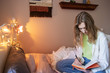 © Haydiddle - Teenage girl writing in journal in her bedroom at home