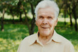 © UpStock 701 - Portrait of happy old senior man with gray hair looking with smile at camera.