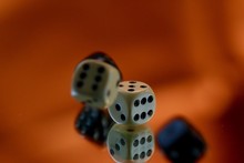 Close-up Of Dices On Glass With Reflections