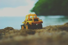 Close-up Of Toy Truck At Beach