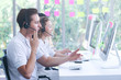 © torsakh - Business people of call center employees are working in office which using headphone to talking with customer, operator consulting