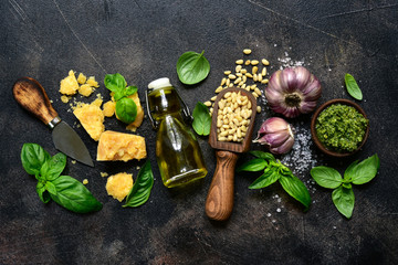 Wall Mural - Delicious homemade basil pesto - traditional italian sauce. Top view with copy space.