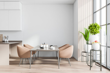 White and wooden dining room interior