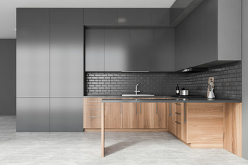 Wooden and grey kitchen interior with island