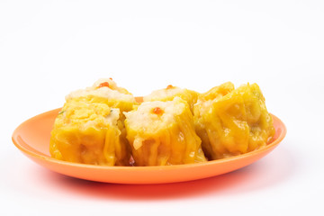 Wall Mural - Siu Mai - Chinese steamed pork dumplings on plate isolated on white background.