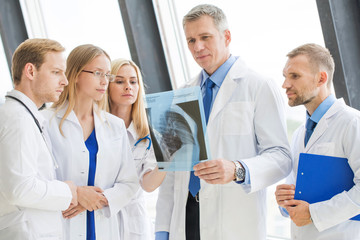 Wall Mural - Team of expert doctors with x-ray