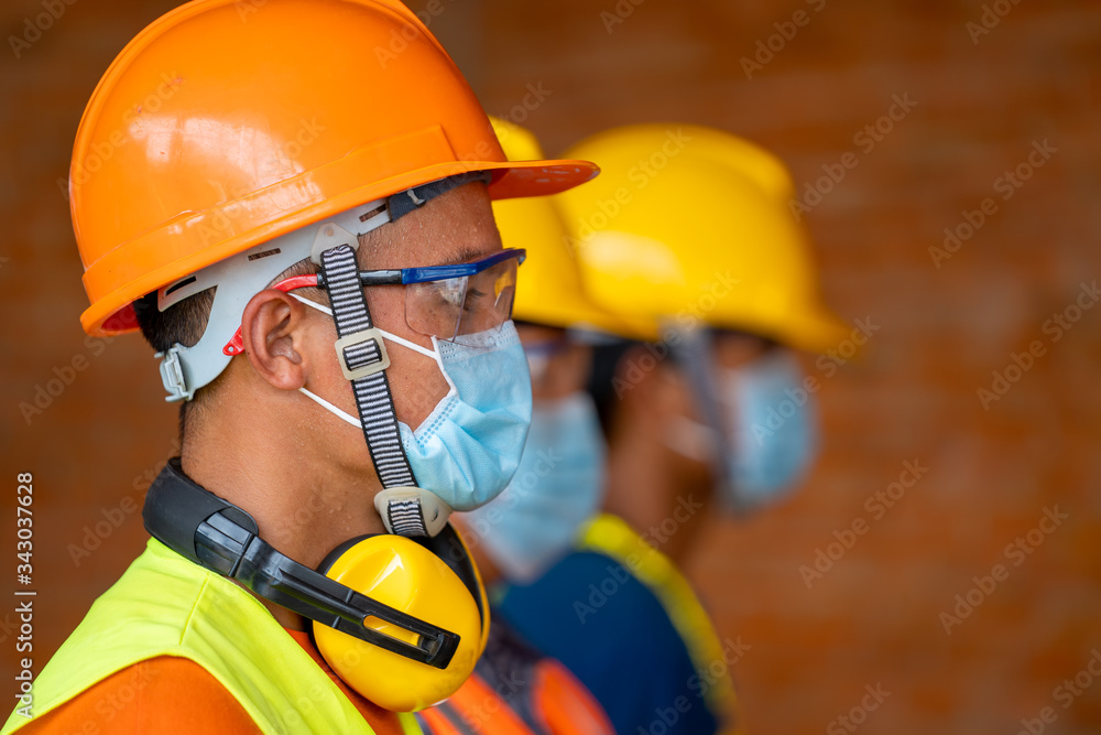 Technician wear protective face masks safety for Coronavirus Disease 2019 (COVID-19) in machine industrial factory,Coronavirus has turned into a global emergency. - obrazy, fototapety, plakaty 