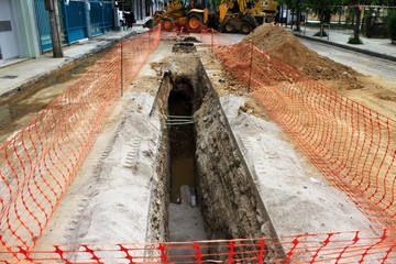 Maintenance and repair of underground pipe system, repair of plastic tube water delivery system, installation of underground water line - Athens, Greece, April 23 2020.