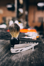 Straight Razor, Brush For Shaving Beard Along With Bowl, Blurred Background Of Hair Salon For Men, Barber Shop