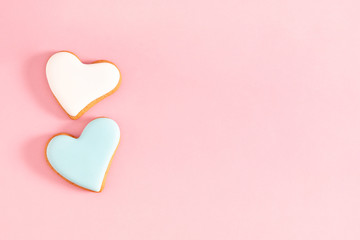 Canvas Print - Ginger cookie in shape heart on pastel pink background. Sweet background. Valentine day food, concept, design. Flat lay, top view, copy space