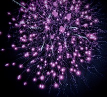 Low Angle View Of Purple Firework Display In Sky