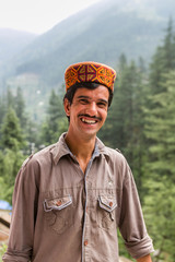 Wall Mural - portrait of a man from himachal pradesh, India with traditional himachali cap