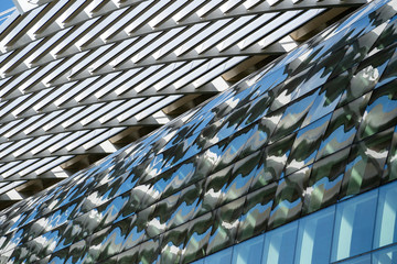 High glass skyscrapers on the streets of Singapore. Office windows background, closeup