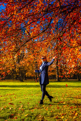 Wall Mural - middle-aged woman walking in city park